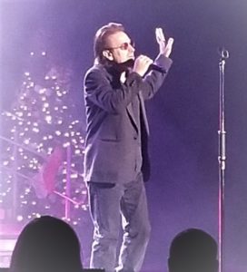 Pavel Sfera as Bono of U2 performing in concert